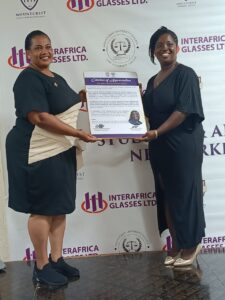 Registrar Ama Akor receiving a citation of recognition
