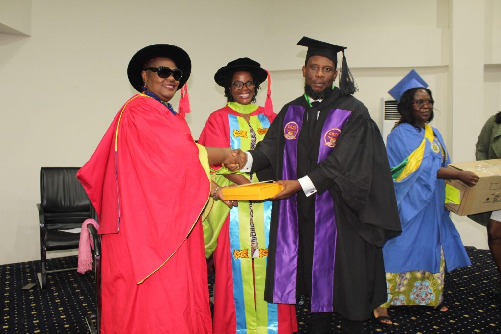 Valedictorian, Muniru Shaibu receiving award from founder, Mrs. Helen Ansa-Asare